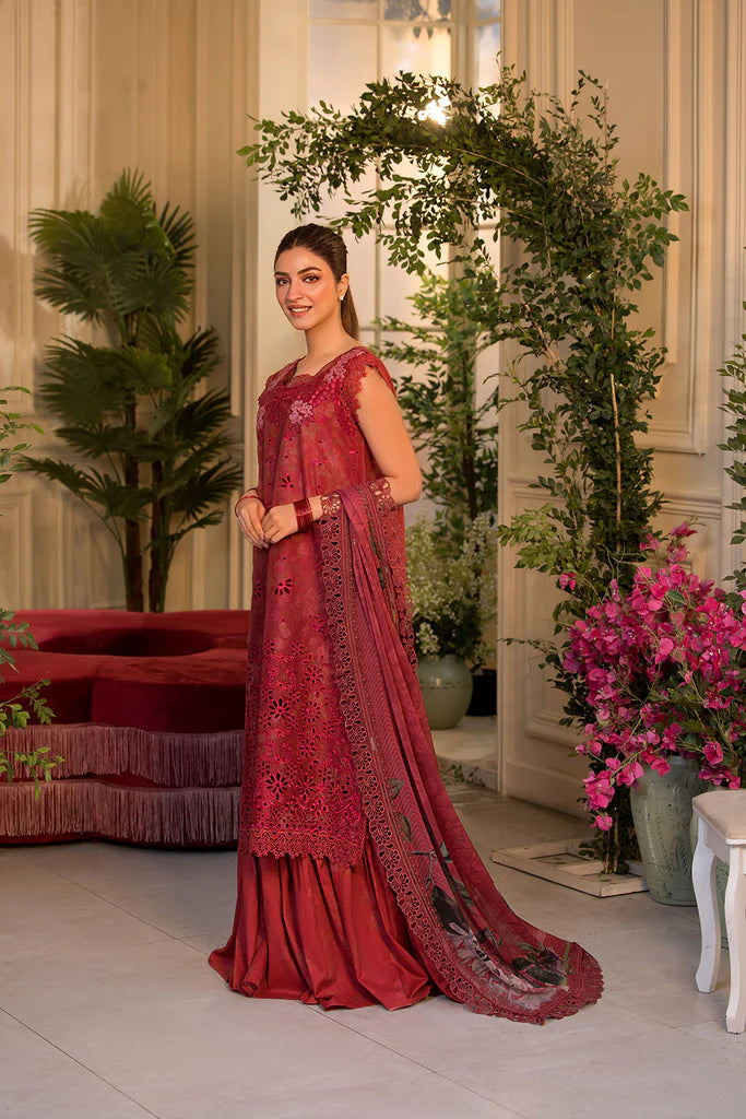 Model wearing Sobia Nazir Vital 2025 Design 8B in red with laser-cut detailing and embroidered dupatta. Shop Pakistani clothes online in UK and explore premium Pakistani luxury pret.