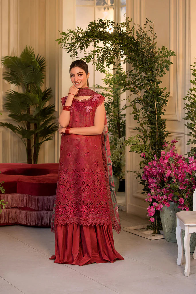Model wearing Sobia Nazir Vital 2025 Design 8B in red with laser-cut detailing and embroidered dupatta. Shop Pakistani clothes online in UK and explore premium Pakistani luxury pret.