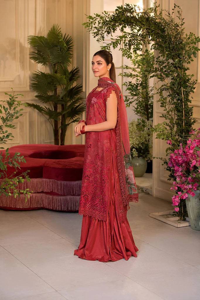 Model wearing Sobia Nazir Vital 2025 Design 8B in red with laser-cut detailing and embroidered dupatta. Shop Pakistani clothes online in UK and explore premium Pakistani luxury pret.