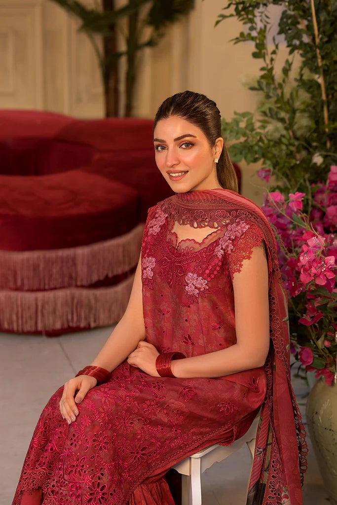 Model wearing Sobia Nazir Vital 2025 Design 8B in red with laser-cut detailing and embroidered dupatta. Shop Pakistani clothes online in UK and explore premium Pakistani luxury pret.