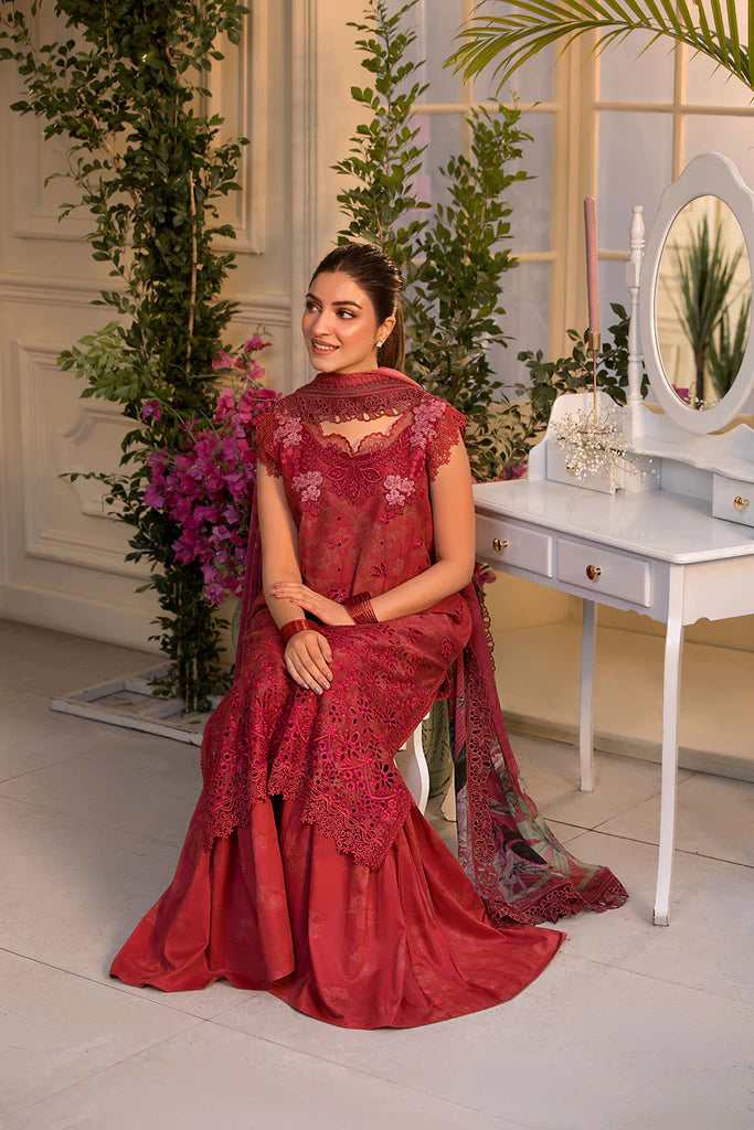 Model wearing Sobia Nazir Vital 2025 Design 8B in red with laser-cut detailing and embroidered dupatta. Shop Pakistani clothes online in UK and explore premium Pakistani luxury pret.