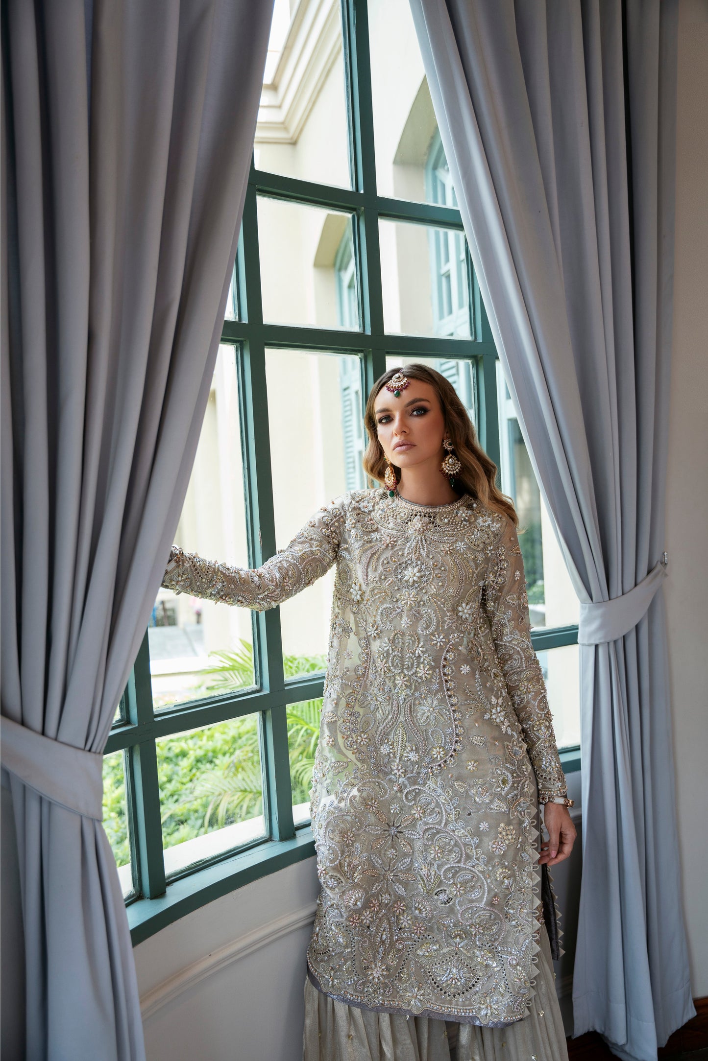 Model wearing Arya from Mysie by Tahira in beige with intricate embellishments, perfect for Pakistani luxury pret in the UK.