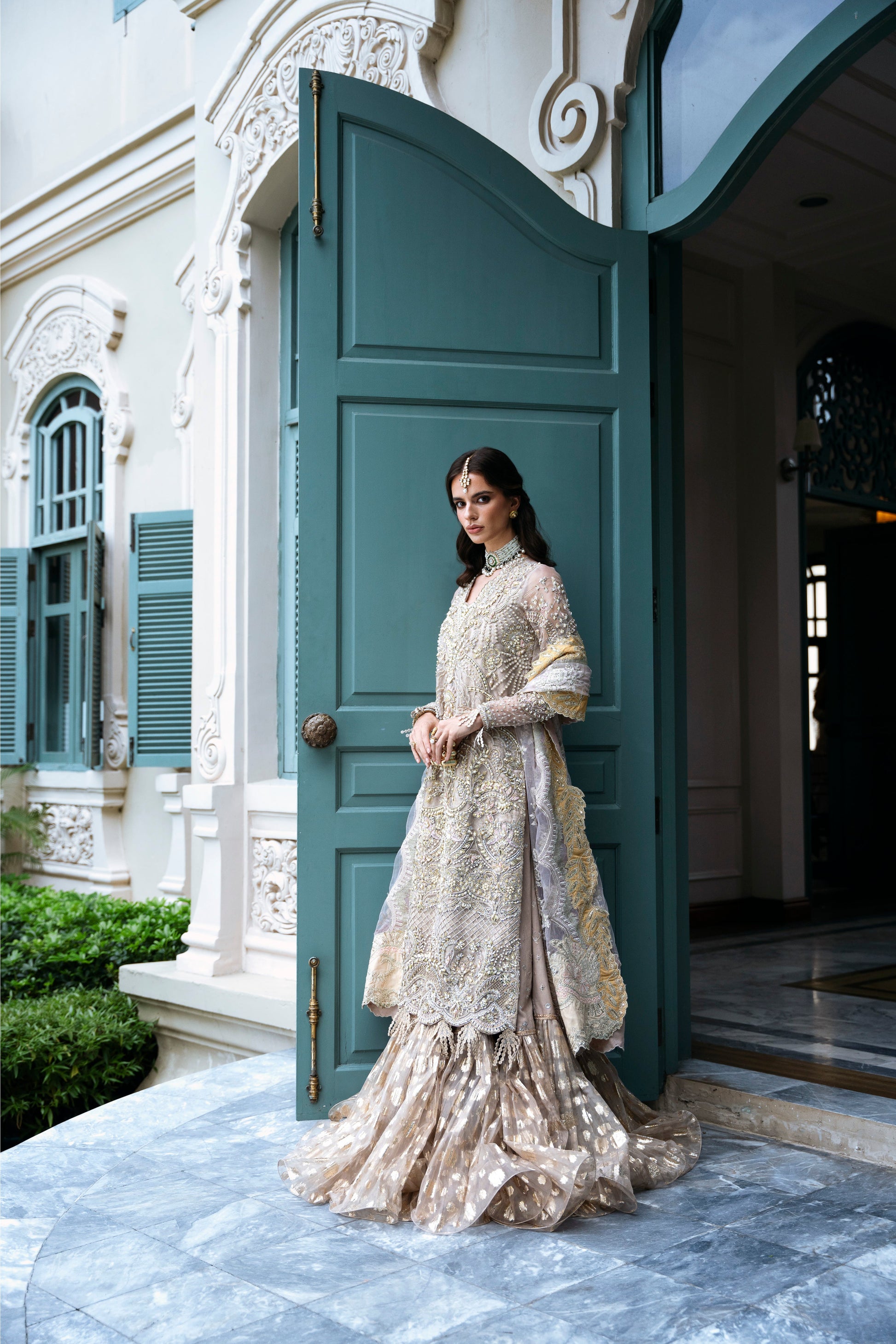Model wearing PEONY from Mysie by Tahira, a soft beige and gold embellished ensemble, perfect for Pakistani luxury pret in the UK.