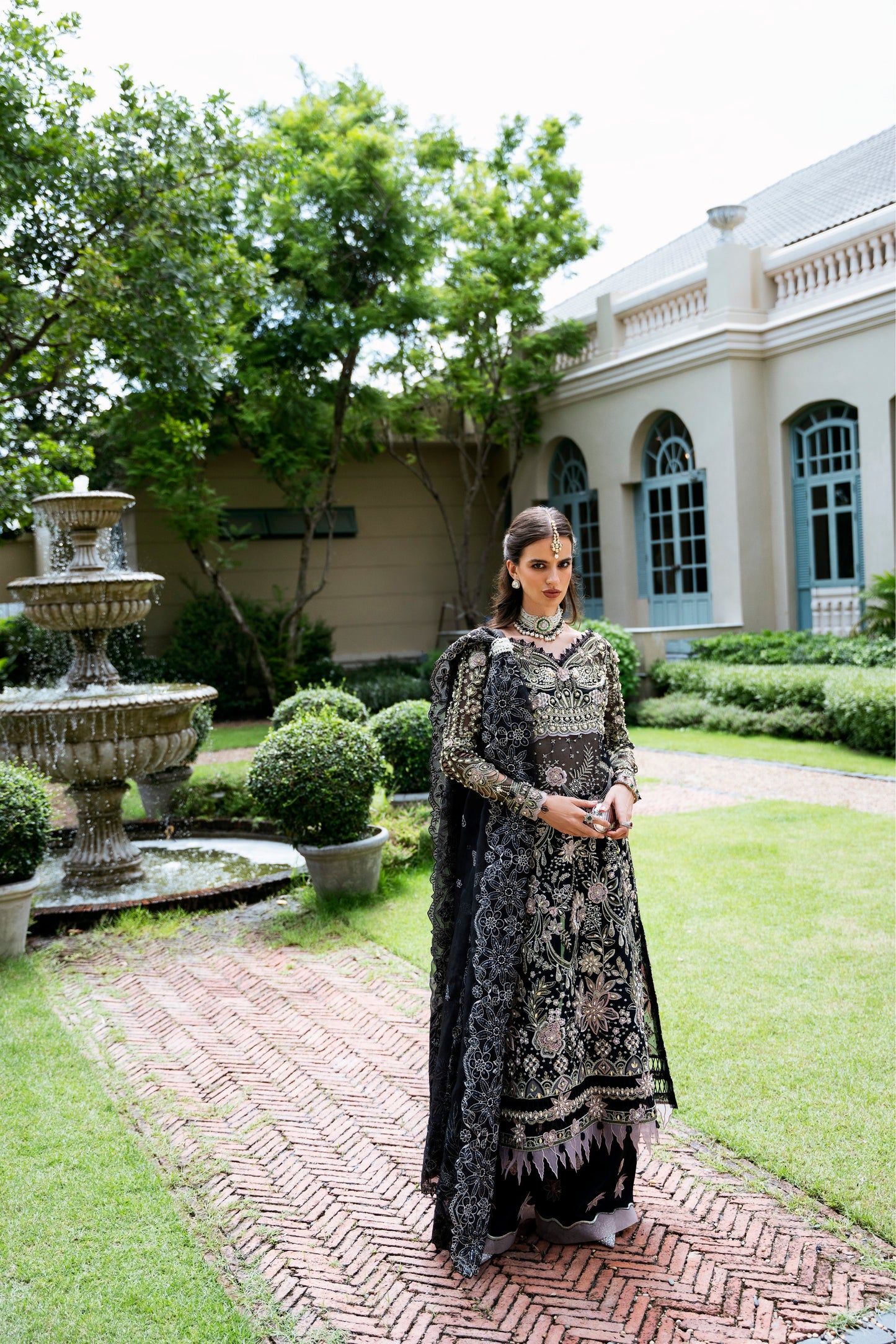 Model wearing Apana from Mysie by Tahira, featuring black luxury pret with intricate embroidery—Pakistani clothes online in UK.
