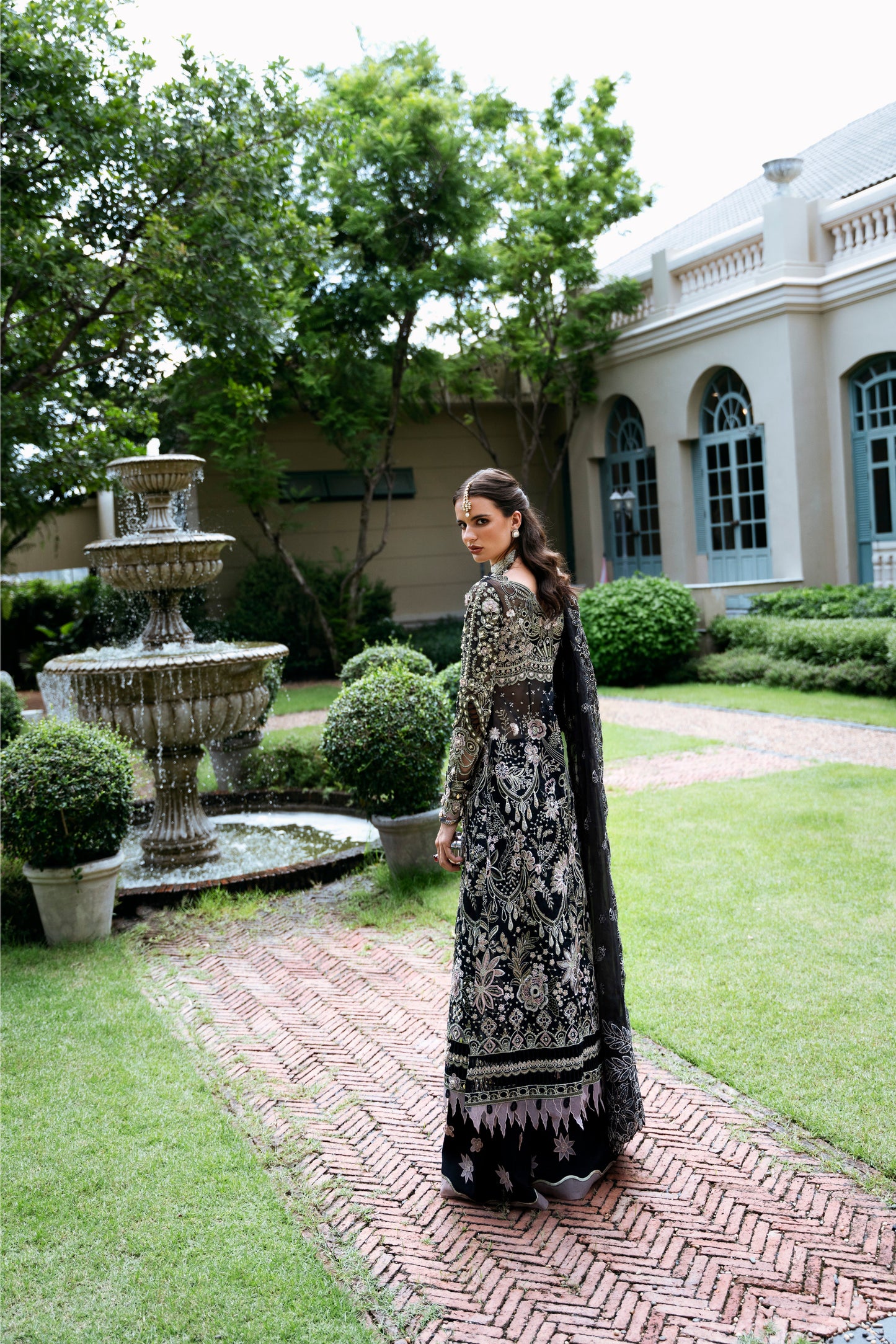 Model wearing Apana from Mysie by Tahira, featuring black luxury pret with intricate embroidery—Pakistani clothes online in UK.