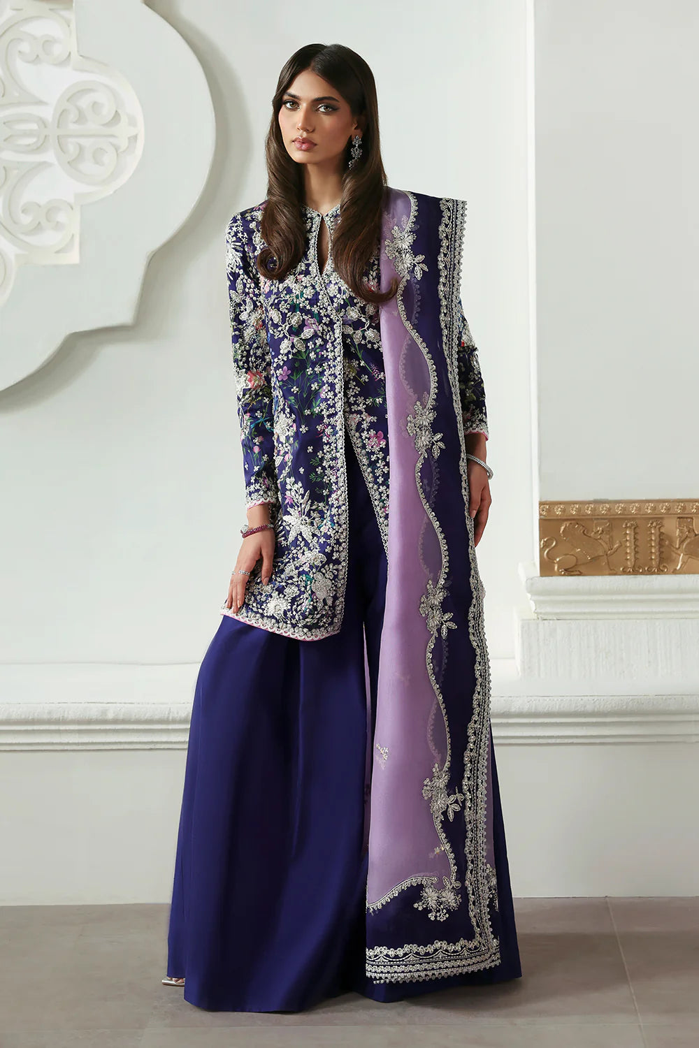 Model wearing Althea by Soraya in deep navy and lavender embroidered outfit – Pakistani luxury pret available online in UK.