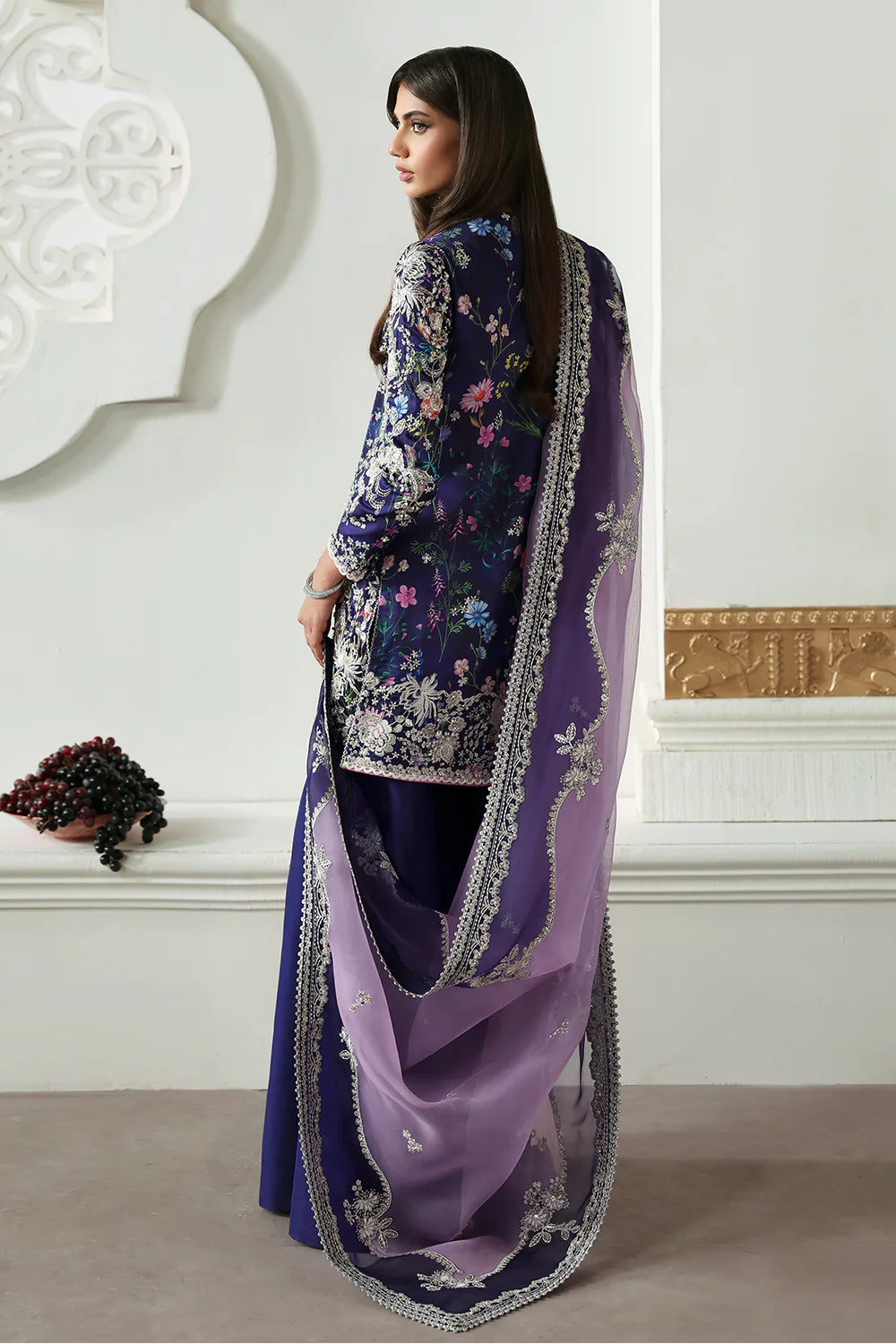 Model wearing Althea by Soraya in deep navy and lavender embroidered outfit – Pakistani luxury pret available online in UK.