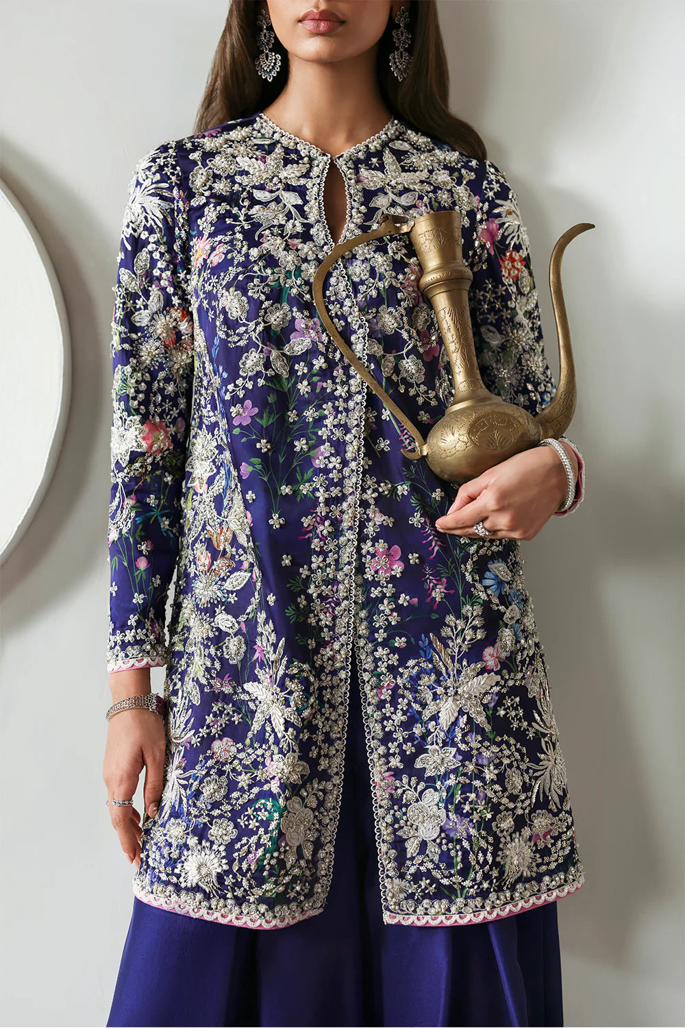 Model wearing Althea by Soraya in deep navy and lavender embroidered outfit – Pakistani luxury pret available online in UK.