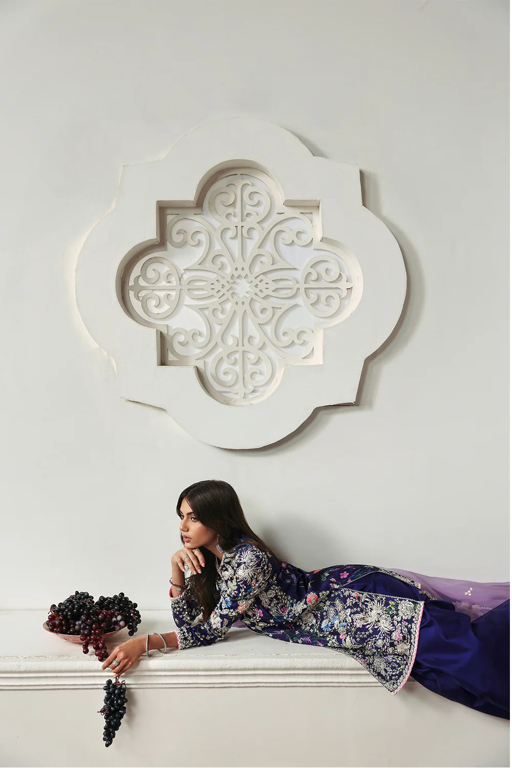 Model wearing Althea by Soraya in deep navy and lavender embroidered outfit – Pakistani luxury pret available online in UK.