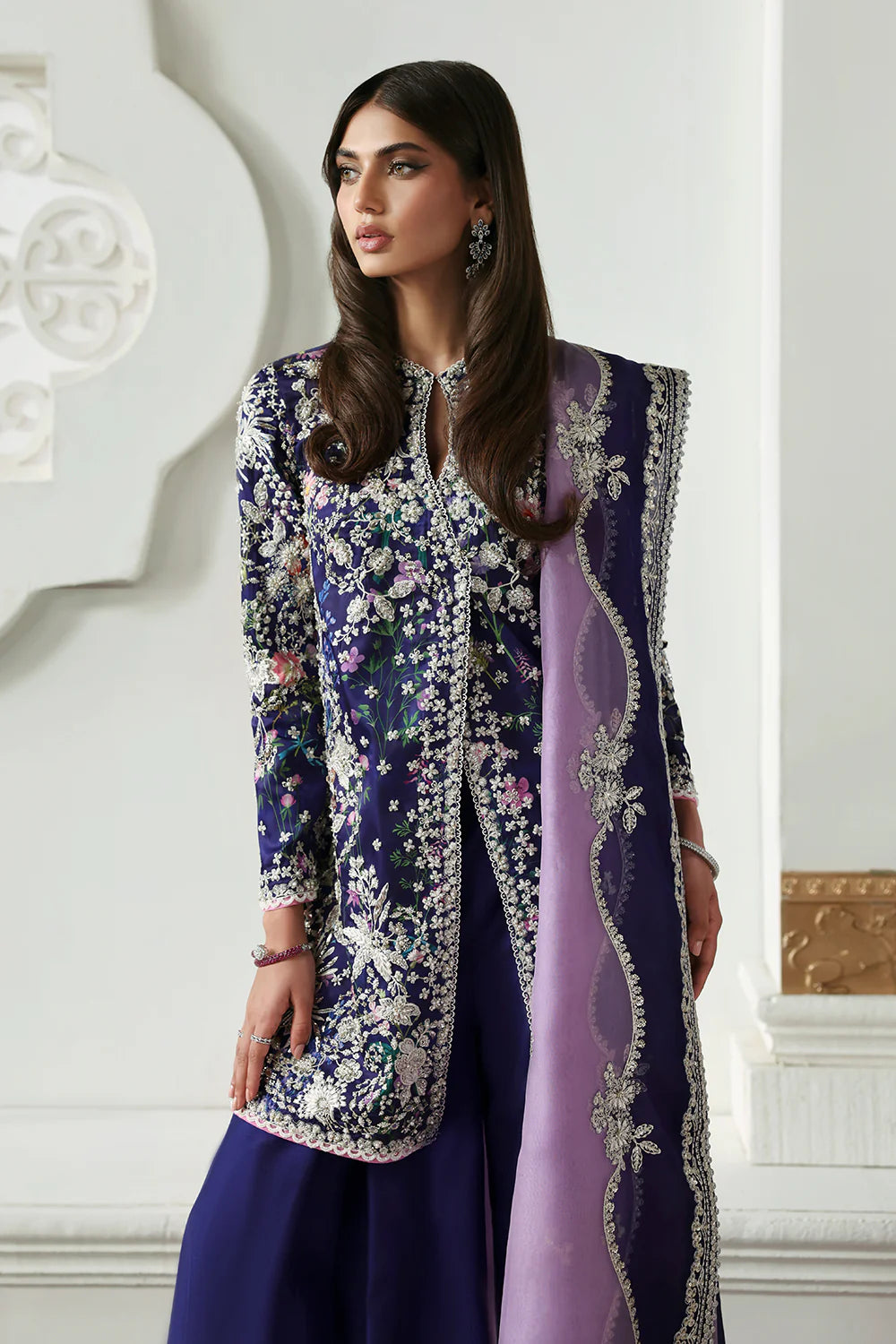 Model wearing Althea by Soraya in deep navy and lavender embroidered outfit – Pakistani luxury pret available online in UK.