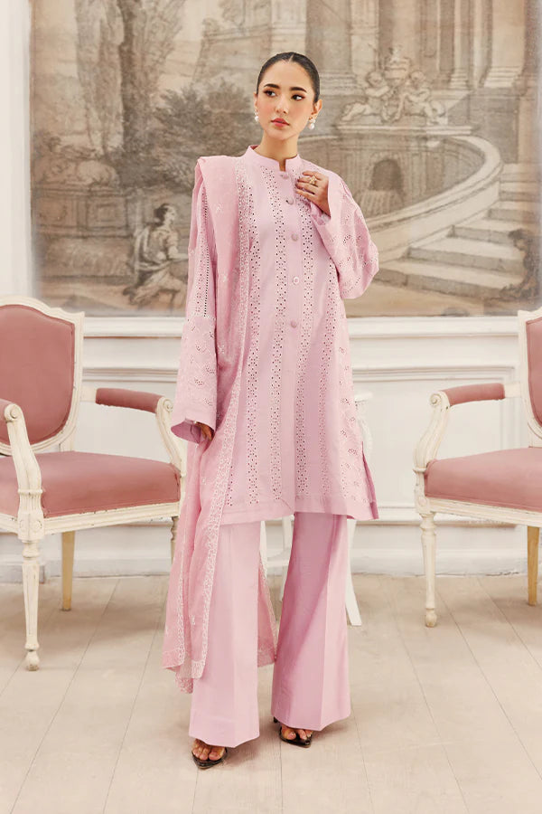 Model wearing Soft Petals by Saffron in pastel pink with delicate cutwork – chic Pakistani luxury pret outfit available online in UK.