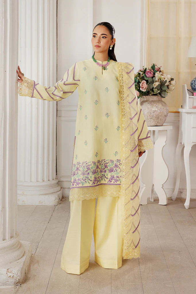 Model wearing Lemon Whisk by Saffron in soft yellow with floral embroidery – Pakistani luxury pret outfit online in UK.
