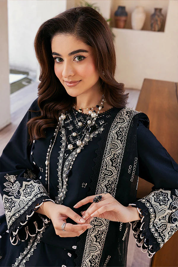 Model wearing black embroidered dress from Saffron Summer Soiree '25 Noir, Pakistani luxury pret available online in UK.