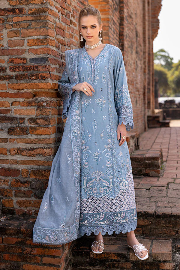 Model wearing powder blue embroidered dress from Saffron Winter Edit Aster, Pakistani luxury pret available online in UK.