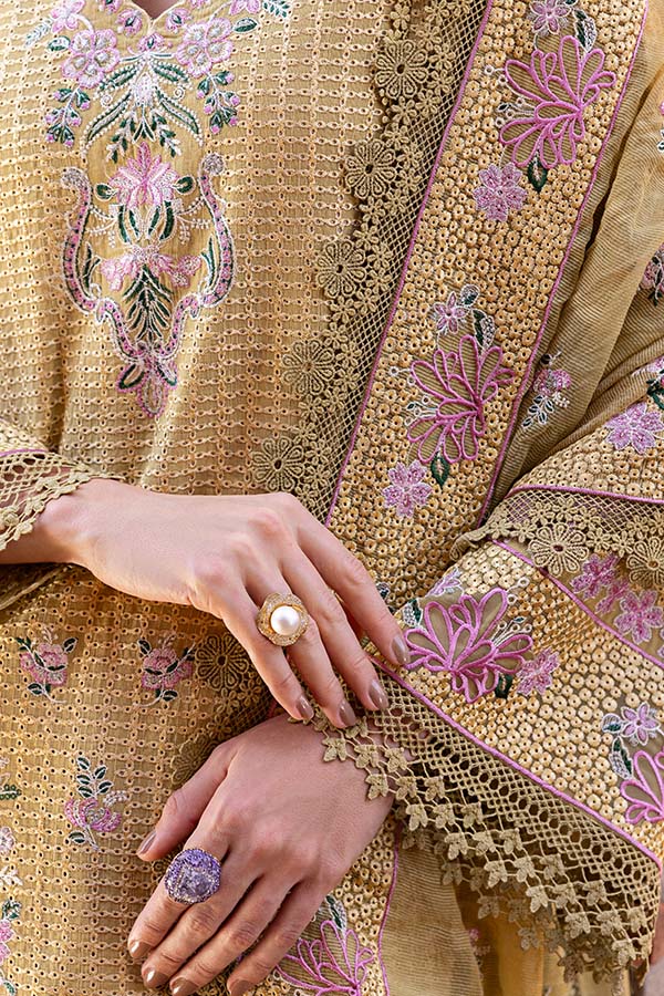 Model wearing mustard embroidered dress from Saffron Winter Edit Camille, Pakistani luxury pret outfit available online in UK.