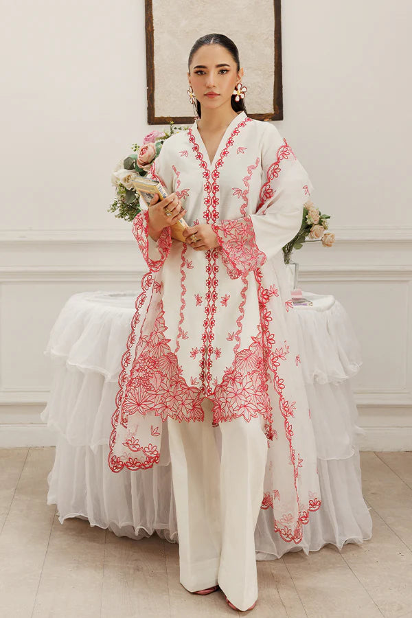 Model wearing Dewtide by Saffron in white with red floral embroidery – elegant Pakistani luxury pret outfit available online in UK.