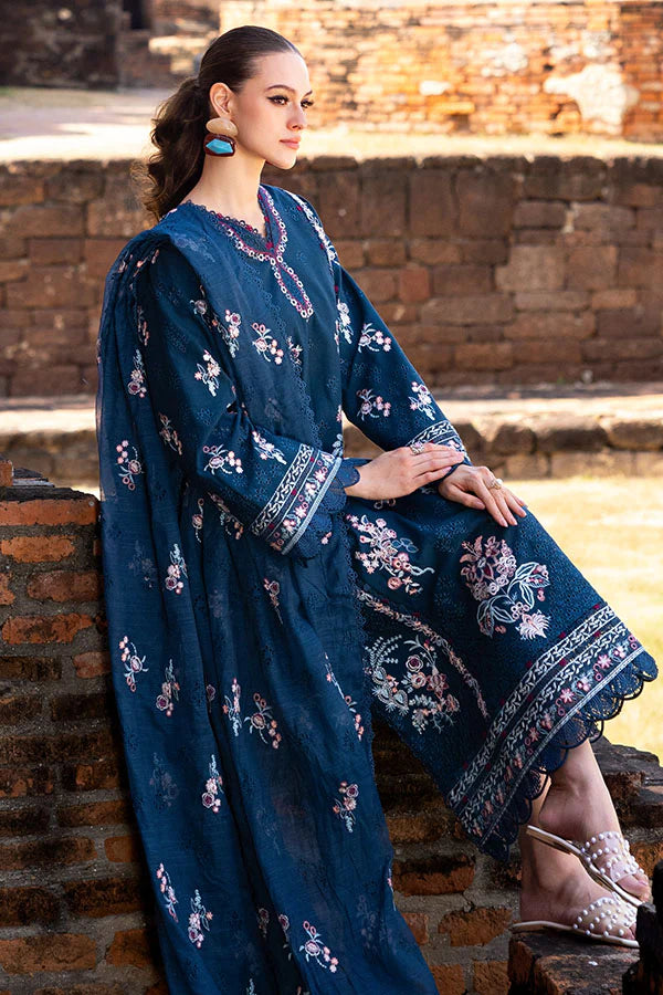 Model wearing deep teal embroidered dress from Saffron Winter Edit Clematis, Pakistani luxury pret available online in UK.