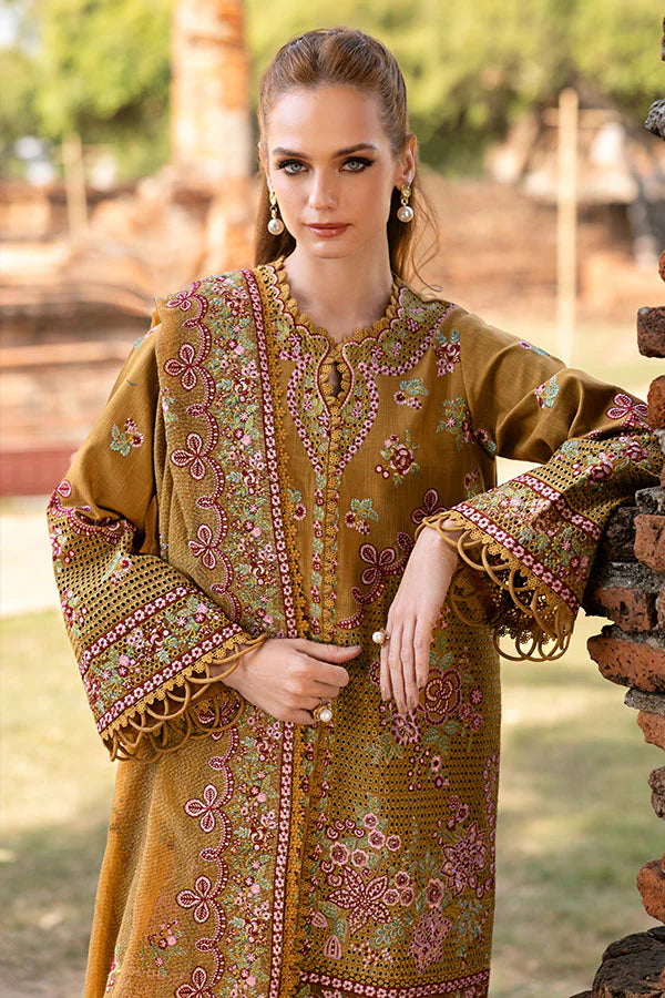 Model wearing mustard yellow embroidered dress from Saffron Winter Edit Aurora, Pakistani luxury pret available online in UK.v