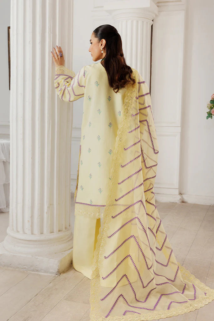 Model wearing Lemon Whisk by Saffron in soft yellow with floral embroidery – Pakistani luxury pret outfit online in UK.