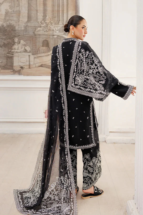 Model wearing Twilight Dreams by Saffron in black with silver embroidery – elegant Pakistani luxury pret outfit available online in UK.