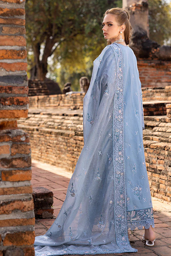 Model wearing powder blue embroidered dress from Saffron Winter Edit Aster, Pakistani luxury pret available online in UK.