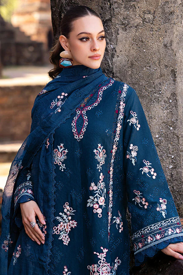 Model wearing deep teal embroidered dress from Saffron Winter Edit Clematis, Pakistani luxury pret available online in UK.
