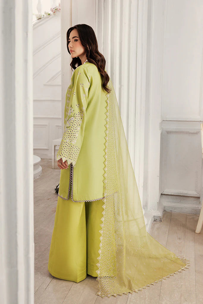Model wearing Pear Drift by Saffron in pastel green with intricate embroidery – elegant Pakistani luxury pret outfit available online in UK.