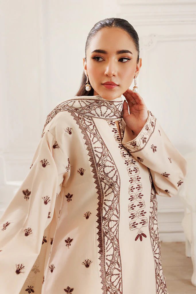 Model wearing Dusky Dreams by Saffron in beige with intricate embroidery – Pakistani luxury pret outfit online in UK.