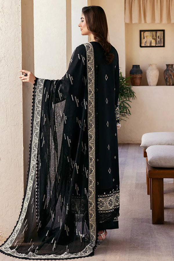Model wearing black embroidered dress from Saffron Summer Soiree '25 Noir, Pakistani luxury pret available online in UK.