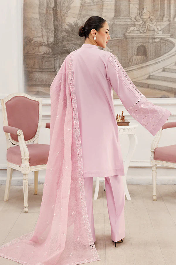 Model wearing Soft Petals by Saffron in pastel pink with delicate cutwork – chic Pakistani luxury pret outfit available online in UK.
