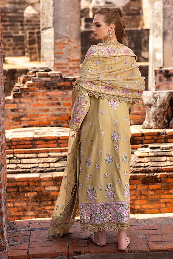 Model wearing mustard embroidered dress from Saffron Winter Edit Camille, Pakistani luxury pret outfit available online in UK.