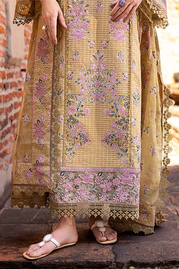 Model wearing mustard embroidered dress from Saffron Winter Edit Camille, Pakistani luxury pret outfit available online in UK.