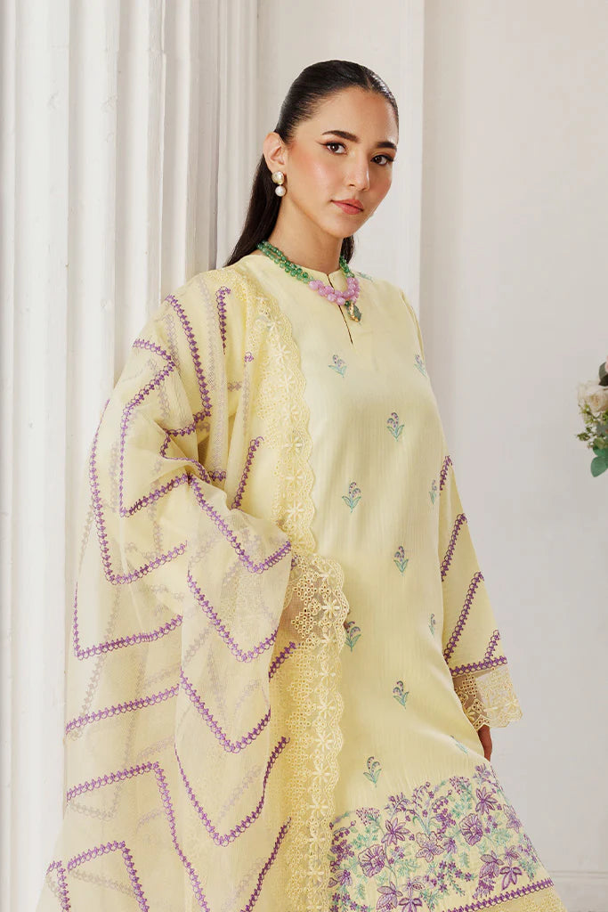 Model wearing Lemon Whisk by Saffron in soft yellow with floral embroidery – Pakistani luxury pret outfit online in UK.