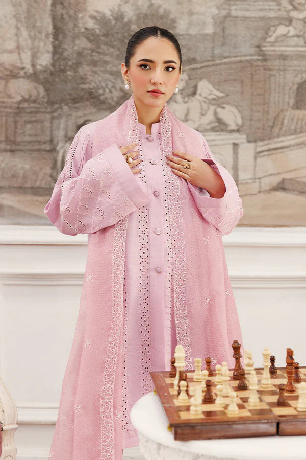 Model wearing Soft Petals by Saffron in pastel pink with delicate cutwork – chic Pakistani luxury pret outfit available online in UK.