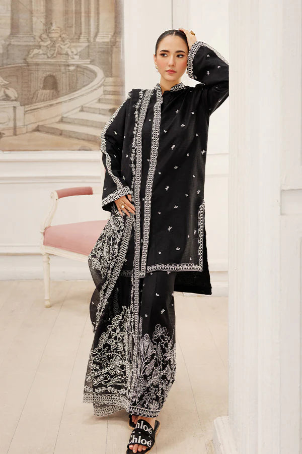 Model wearing Twilight Dreams by Saffron in black with silver embroidery – elegant Pakistani luxury pret outfit available online in UK.