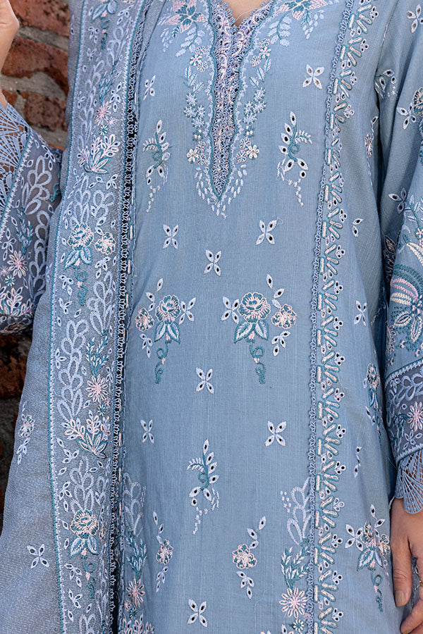 Model wearing powder blue embroidered dress from Saffron Winter Edit Aster, Pakistani luxury pret available online in UK.
