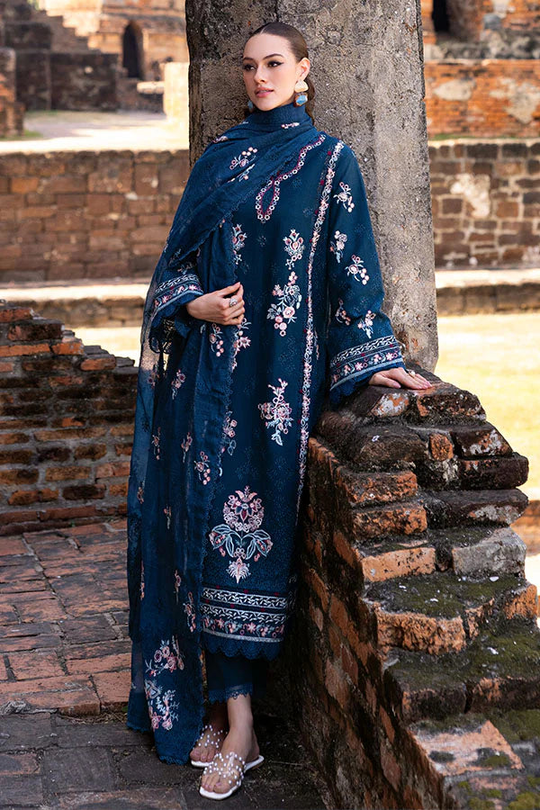 Model wearing deep teal embroidered dress from Saffron Winter Edit Clematis, Pakistani luxury pret available online in UK.