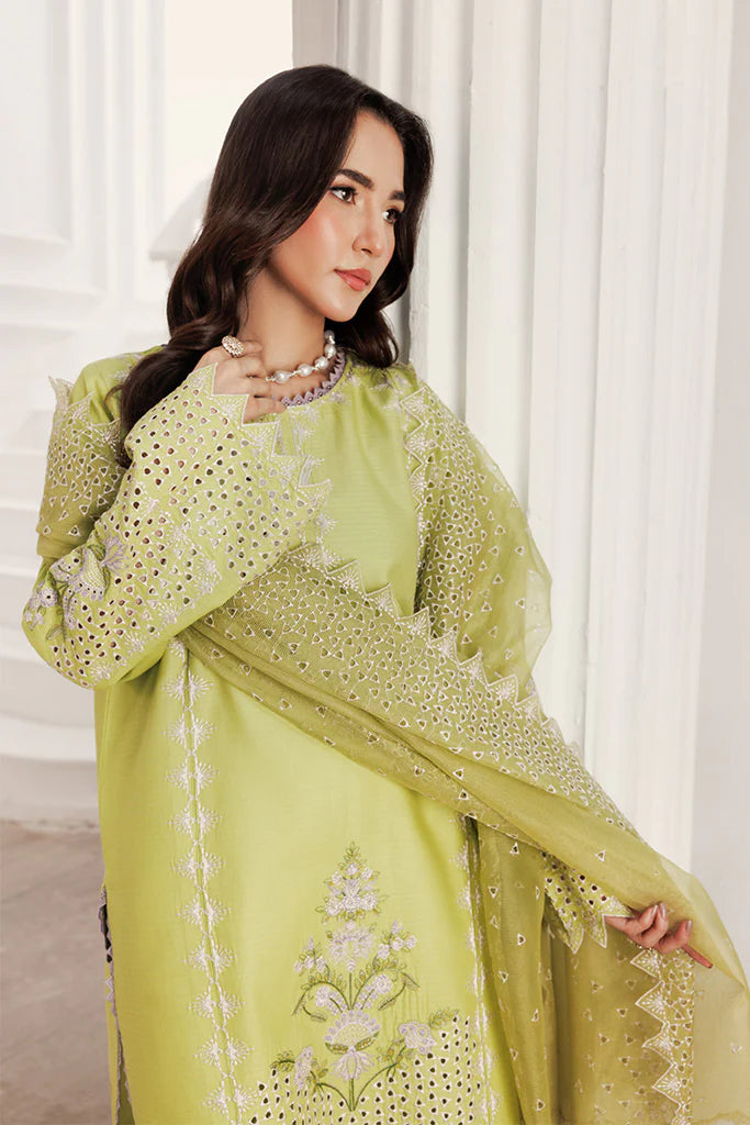 Model wearing Pear Drift by Saffron in pastel green with intricate embroidery – elegant Pakistani luxury pret outfit available online in UK.