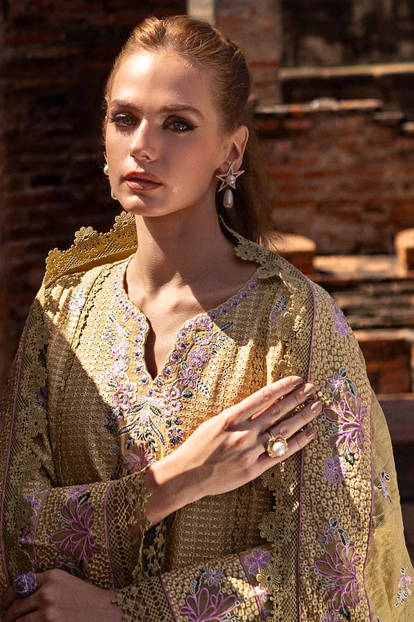 Model wearing mustard embroidered dress from Saffron Winter Edit Camille, Pakistani luxury pret outfit available online in UK.