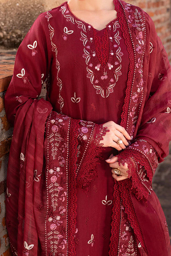 Model wearing deep maroon embroidered dress from Saffron Winter Edit Odette, Pakistani luxury pret available online in UK.