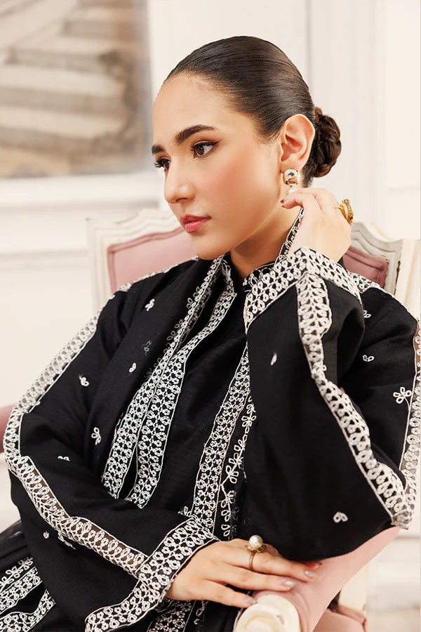 Model wearing Twilight Dreams by Saffron in black with silver embroidery – elegant Pakistani luxury pret outfit available online in UK.