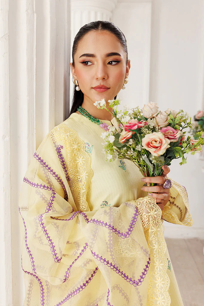 Model wearing Lemon Whisk by Saffron in soft yellow with floral embroidery – Pakistani luxury pret outfit online in UK.