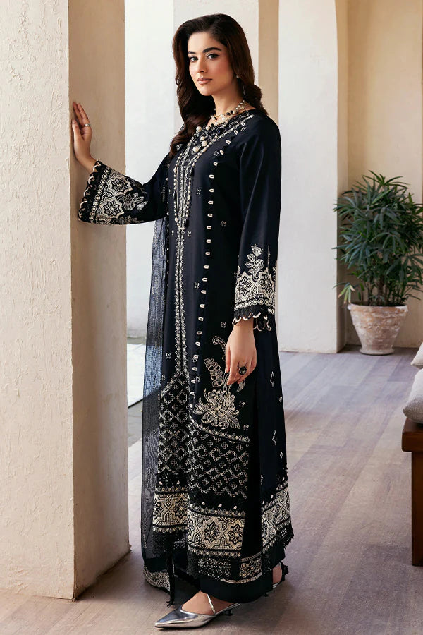 Model wearing black embroidered dress from Saffron Summer Soiree '25 Noir, Pakistani luxury pret available online in UK.