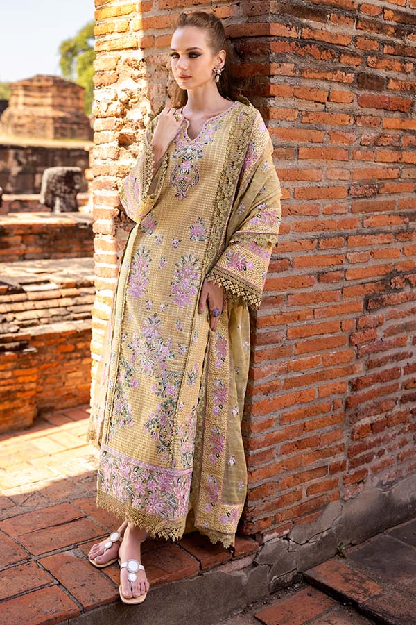 Model wearing mustard embroidered dress from Saffron Winter Edit Camille, Pakistani luxury pret outfit available online in UK.