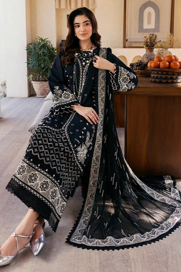 Model wearing black embroidered dress from Saffron Summer Soiree '25 Noir, Pakistani luxury pret available online in UK.