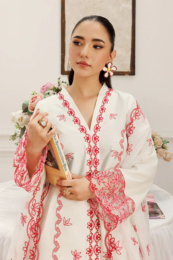 Model wearing Dewtide by Saffron in white with red floral embroidery – elegant Pakistani luxury pret outfit available online in UK.