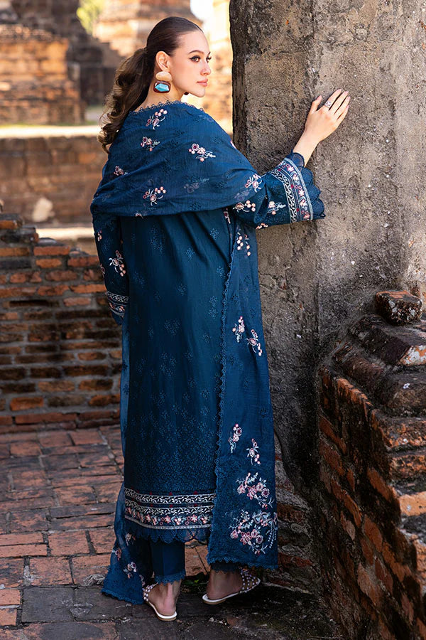 Model wearing deep teal embroidered dress from Saffron Winter Edit Clematis, Pakistani luxury pret available online in UK.
