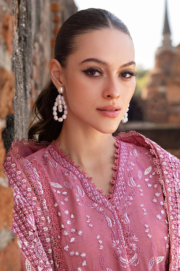 Model wearing rose pink embroidered dress from Saffron Winter Edit Froza, Pakistani luxury pret available online in UK.