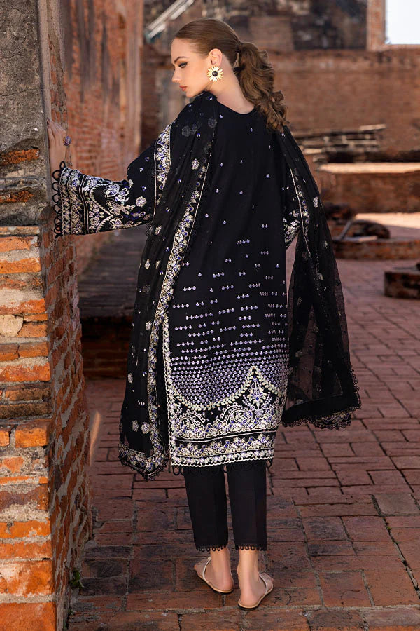 Model wearing black embroidered dress from Saffron Winter Edit Belle collection, Pakistani Luxury pret available online in UK.