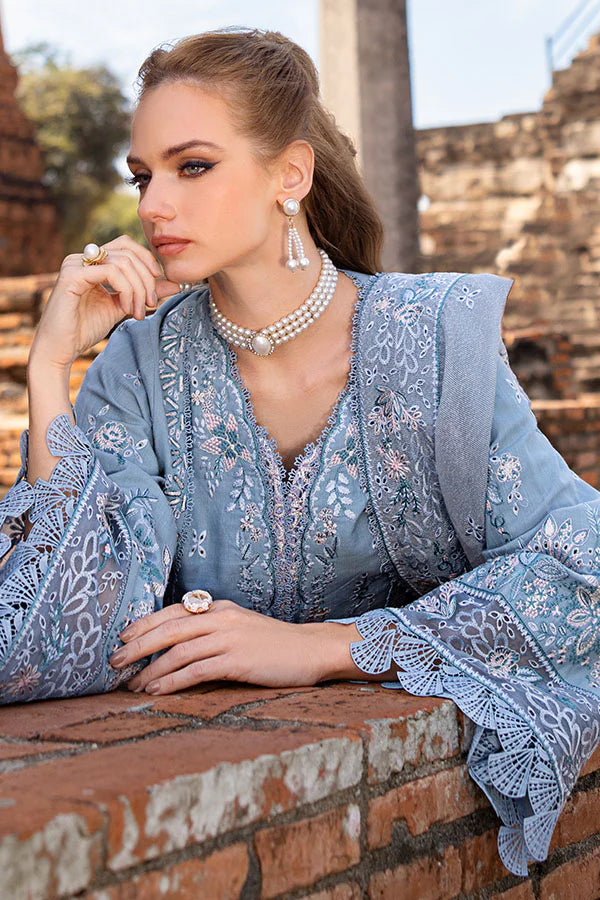Model wearing powder blue embroidered dress from Saffron Winter Edit Aster, Pakistani luxury pret available online in UK.